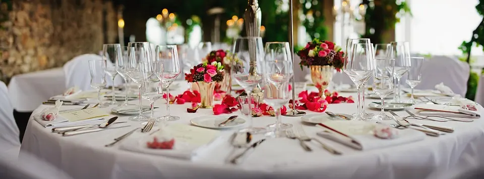 Event table decorated with red flowers
